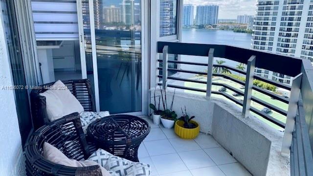 balcony featuring a water view