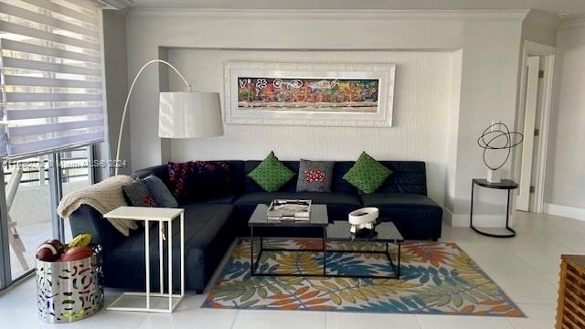 tiled living room featuring crown molding