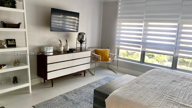 bedroom with light tile patterned floors