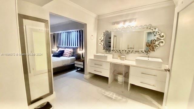 bathroom with vanity and ornamental molding