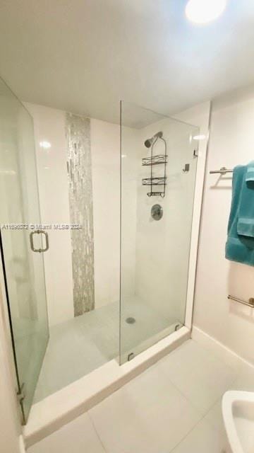 bathroom featuring tile patterned floors and an enclosed shower