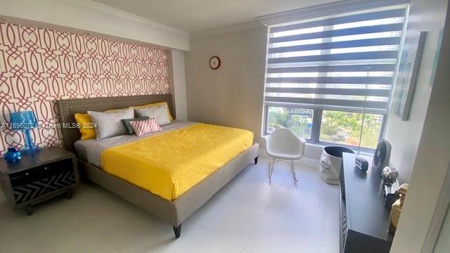 bedroom with ornamental molding