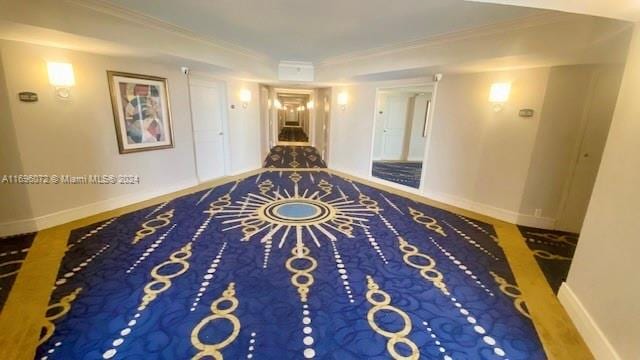 hallway featuring hardwood / wood-style floors and ornamental molding