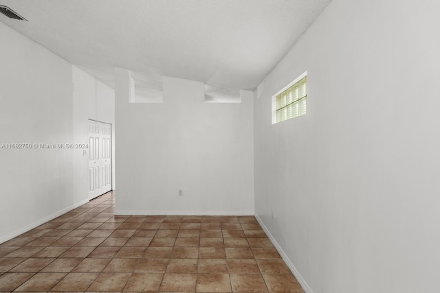 view of tiled spare room