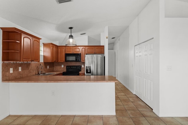 kitchen featuring black appliances, kitchen peninsula, sink, and hanging light fixtures