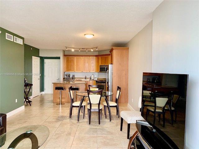 view of tiled dining room