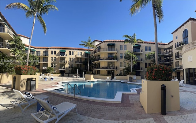 view of swimming pool featuring a patio