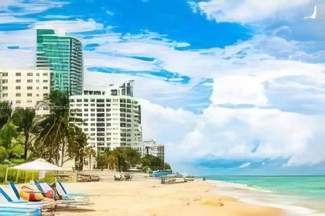 exterior space featuring a water view and a view of the beach