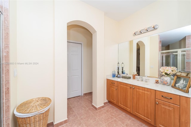 bathroom featuring tile patterned floors and vanity