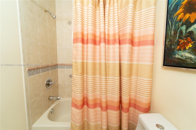 bathroom featuring shower / bathtub combination with curtain