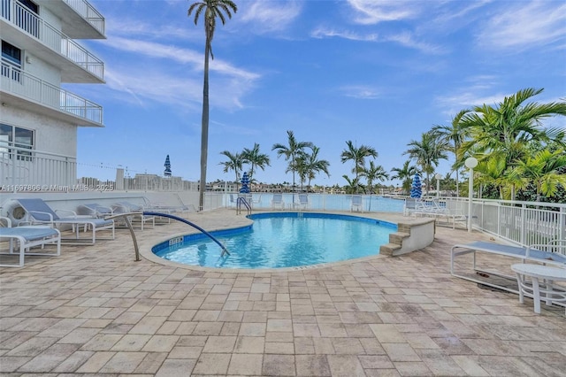 view of swimming pool with a patio