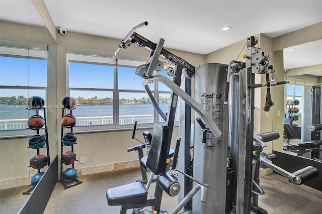 gym featuring a water view