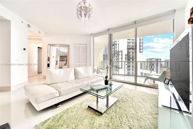 living room featuring tile patterned floors and floor to ceiling windows