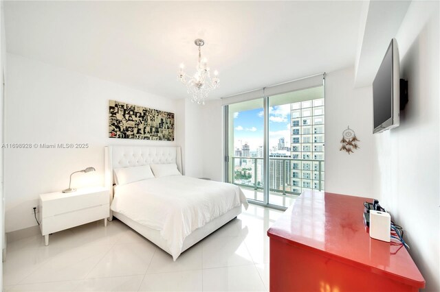 tiled bedroom featuring a notable chandelier, access to exterior, and a wall of windows