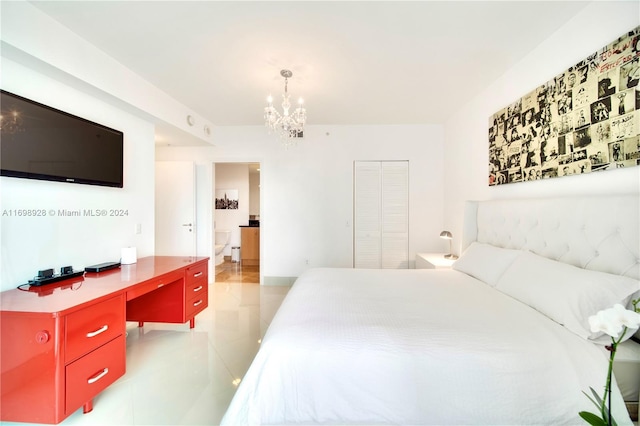 tiled bedroom featuring a closet and an inviting chandelier