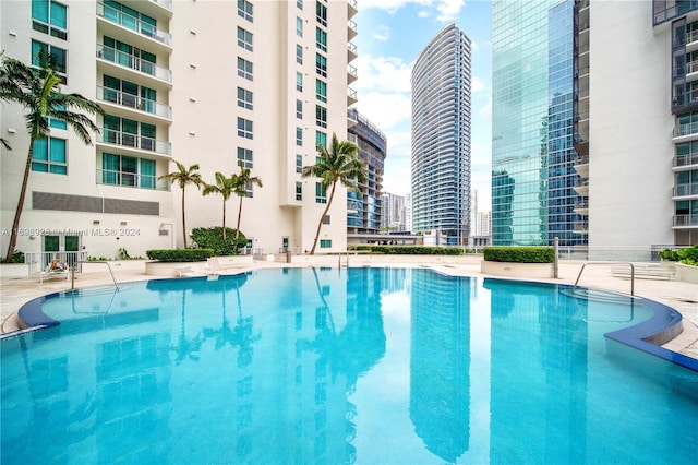 view of swimming pool featuring a patio area