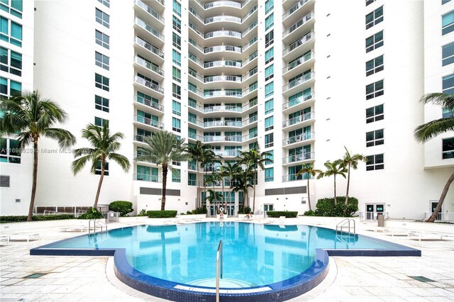 view of swimming pool featuring a patio area