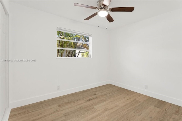 unfurnished room with ceiling fan and light wood-type flooring