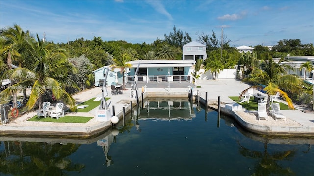 back of house with a water view