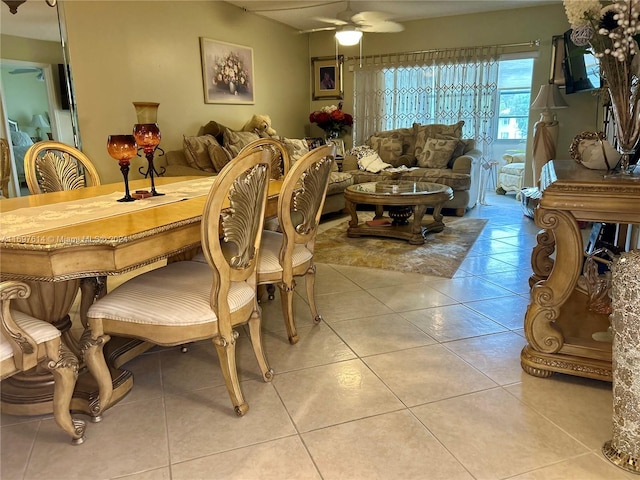 dining space featuring ceiling fan and light tile patterned floors