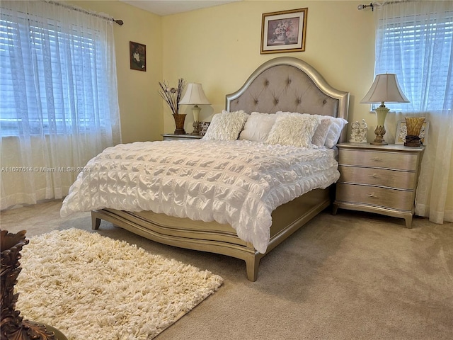 bedroom with light colored carpet