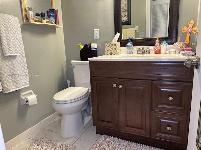 bathroom with tile patterned floors, vanity, and toilet