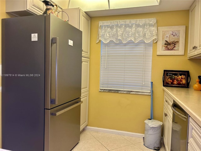 kitchen featuring light tile patterned flooring and appliances with stainless steel finishes