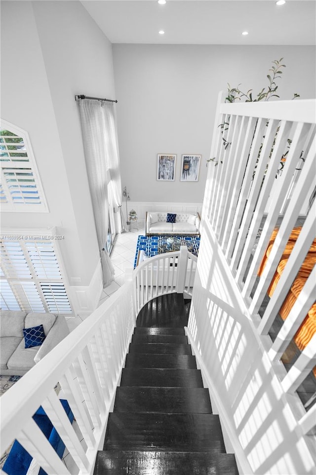 stairs with hardwood / wood-style flooring