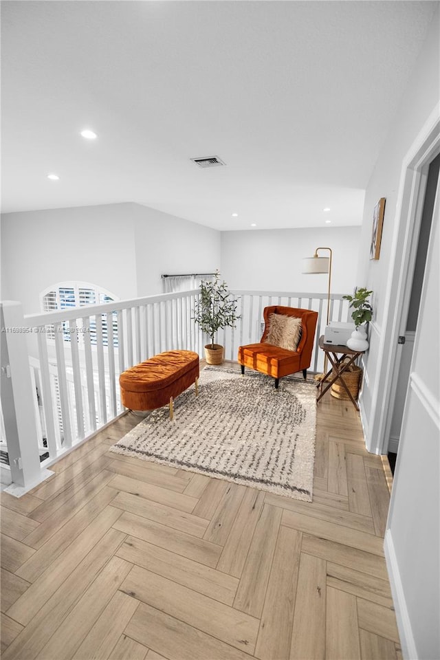 living area featuring light parquet floors