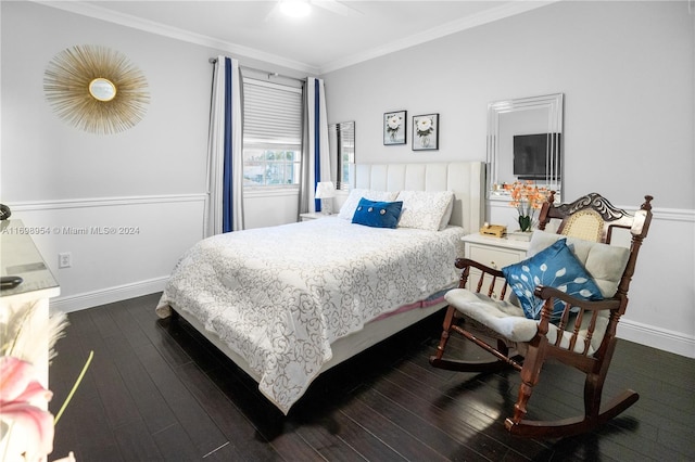 bedroom featuring ceiling fan, dark hardwood / wood-style flooring, and crown molding