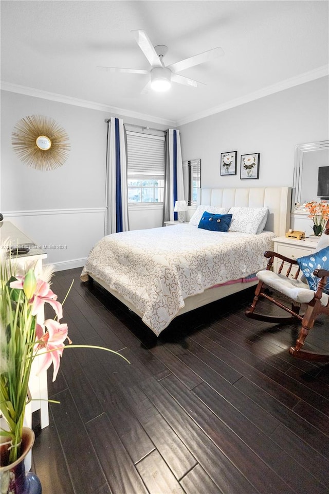 bedroom featuring ceiling fan, wood-type flooring, and ornamental molding