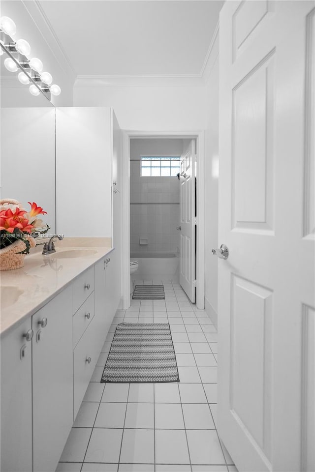 full bathroom with tile patterned floors, vanity, toilet, and ornamental molding