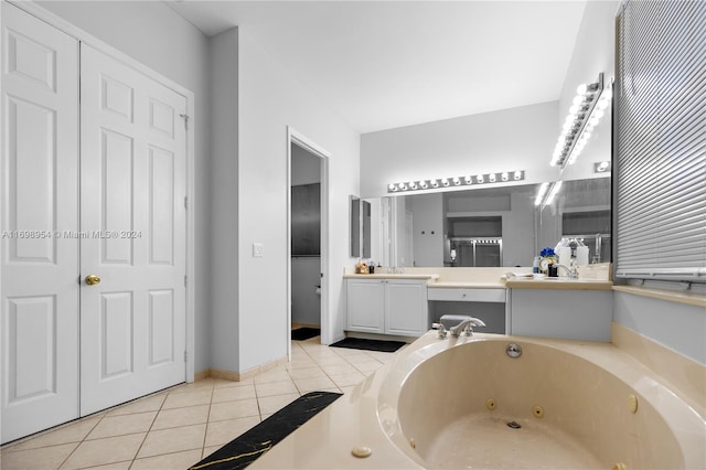 bathroom with vanity, tile patterned floors, and a tub