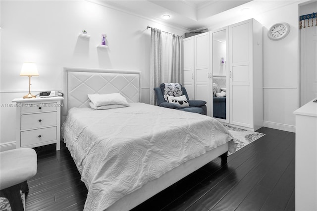 bedroom featuring dark hardwood / wood-style flooring