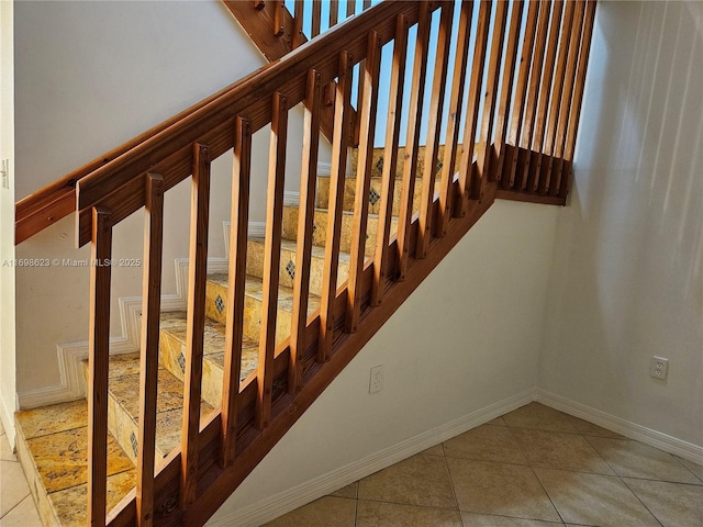 stairway featuring tile patterned floors