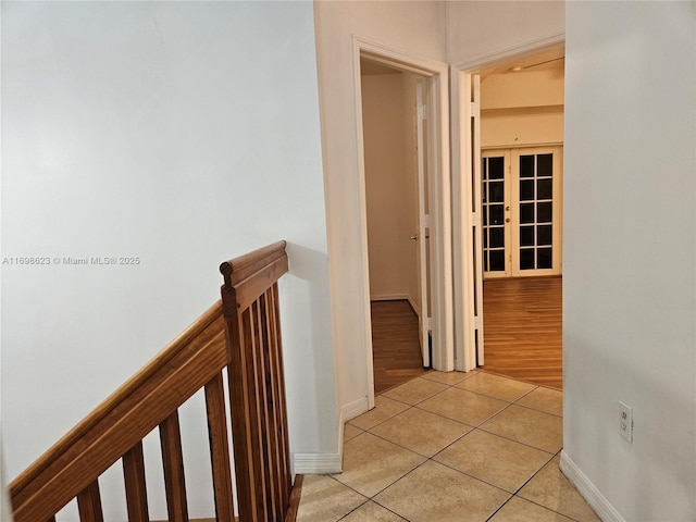 hallway with light tile patterned floors