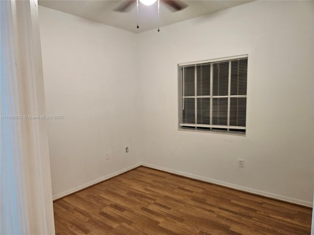 spare room featuring wood-type flooring and ceiling fan