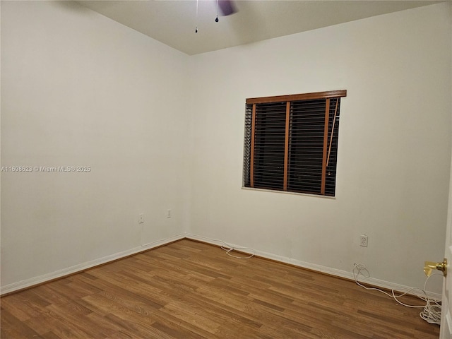 unfurnished room with hardwood / wood-style floors and ceiling fan