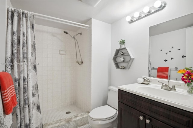 bathroom with walk in shower, vanity, and toilet