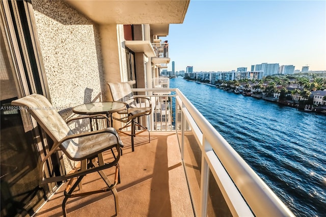 balcony featuring a water view