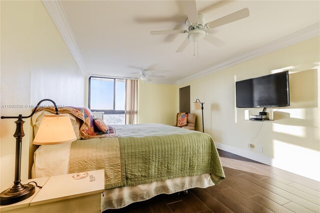 bedroom featuring wood-type flooring, ceiling fan, and crown molding