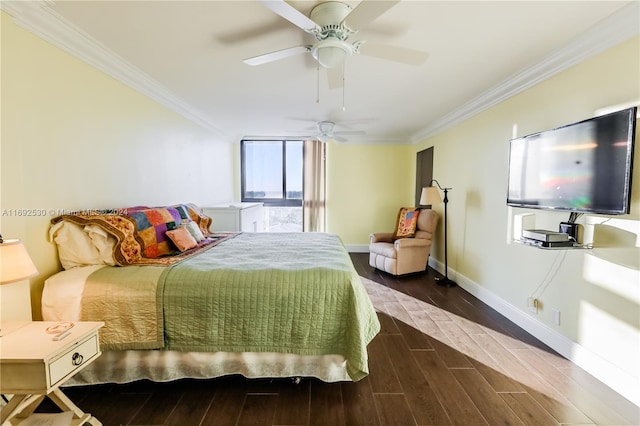 bedroom featuring ceiling fan, dark hardwood / wood-style flooring, and crown molding