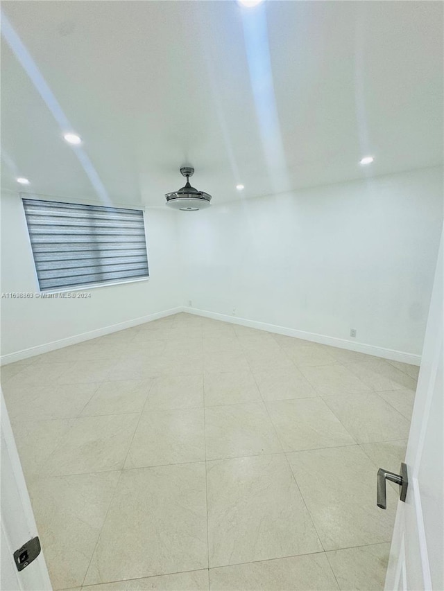 unfurnished room featuring light tile patterned floors