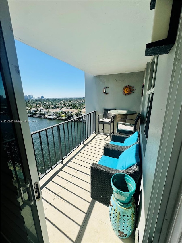 balcony featuring a water view