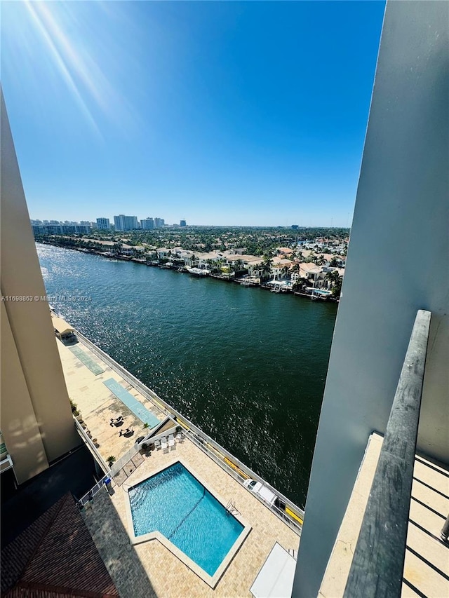 view of pool with a water view