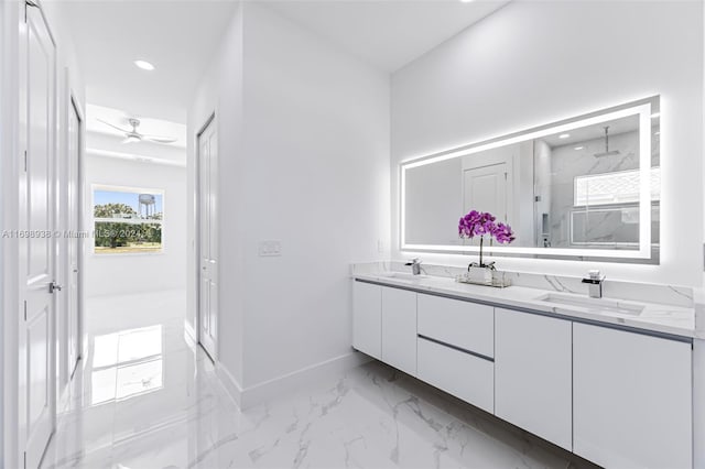 bathroom featuring ceiling fan, vanity, and walk in shower