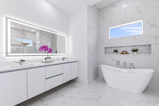 bathroom featuring a bathtub and vanity