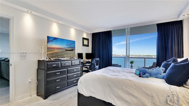 bedroom with light wood-type flooring