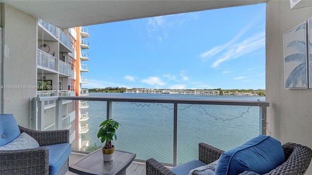 balcony featuring a water view