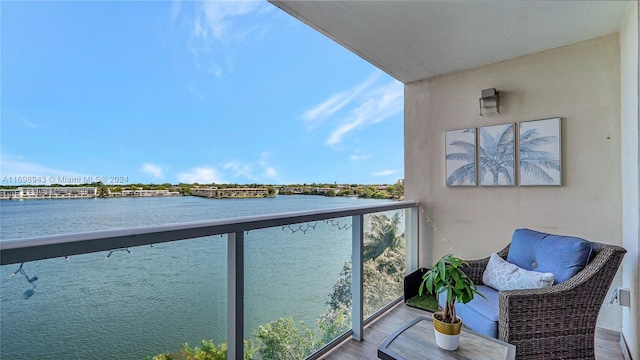 balcony featuring a water view